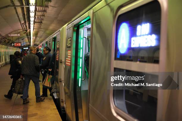 People enter the new R211 open gangway subway train arrives at the 207 St A subway station on March 10, 2023 in New York City. MTA leadership...