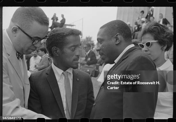 American performer Sammy Davis Jr and comedian and Civil Rights activist Dick Gregory talk outside the Lincoln Memorial during the March on...
