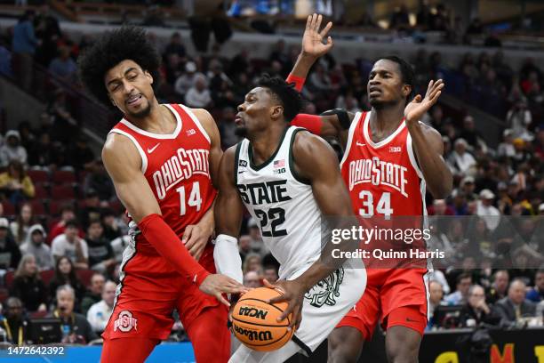 Mady Sissoko of the Michigan State Spartans is fouled by Justice Sueing of the Ohio State Buckeyes during the first half in the quarterfinals of the...