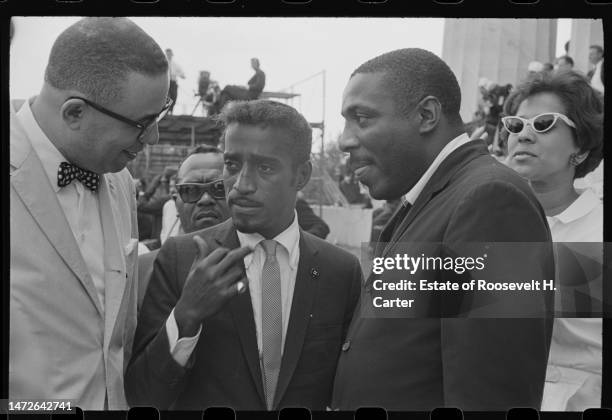 American performer Sammy Davis Jr and comedian and Civil Rights activist Dick Gregory talk outside the Lincoln Memorial during the March on...