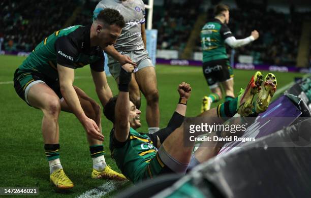 Tom Collins of Northampton Saints celebrates after scoring their fifth try during the Gallagher Premiership Rugby match between Northampton Saints...