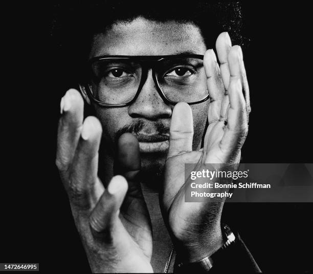 Musician Herbie Hancock stares at camera through his hands mid-clap in Los Angeles in 1980.