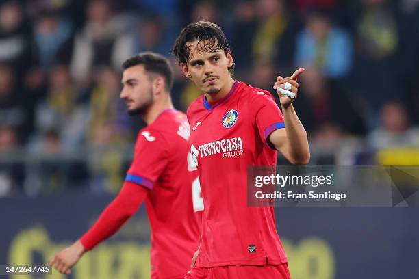 Enes Unal of Getafe CF celebrates after scoring the team's first goal from the penalty spot during the LaLiga Santander match between Cadiz CF and...