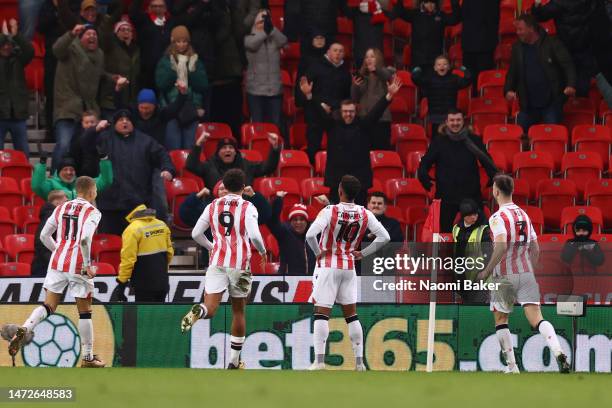 Tyrese Campbell of Stoke City celebrates with teammates and fans after scoring the team's third goal during the Sky Bet Championship between Stoke...