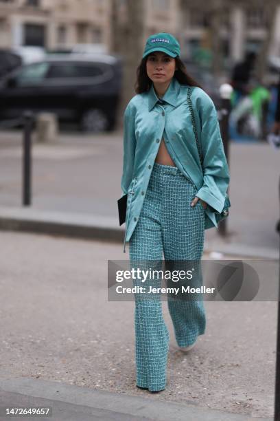 Fer Millan Delaroiere seen wearing a blue oversized blouse, a blue cap, blue tweed wide leg pants and a matching blue bag before the Chanel show on...