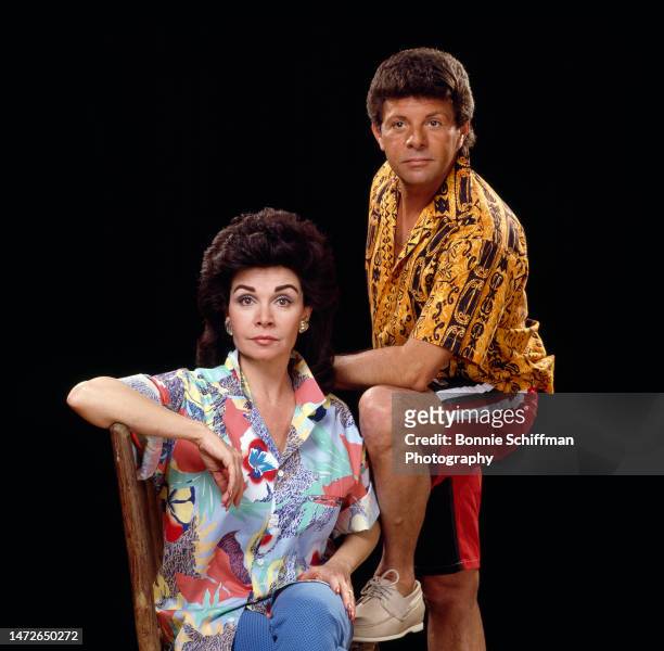 Actors Frankie Avalon and Annette Funicello pose straightfaced in front of a black backdrop in Los Angeles in 1987. She is seated with her elbow on...