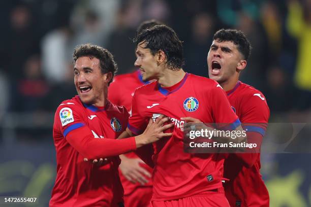 Enes Unal of Getafe CF celebrates with teammates after scoring the team's second goal from the penalty spot during the LaLiga Santander match between...