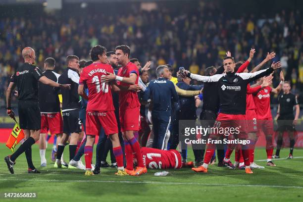 Players of Getafe CF react after an object was thrown on to the pitch from the stands during the LaLiga Santander match between Cadiz CF and Getafe...