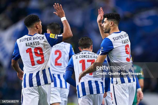 Mehdi Taremi of FC Porto celebrates with Danny Namaso after scoring his team's third goal during the Liga Portugal Bwin match between FC Porto and GD...