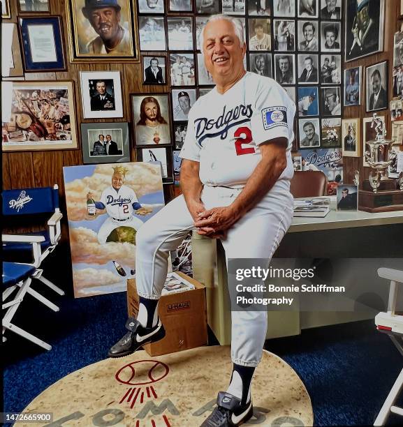 Los Angeles Dodgers manager Tommy Lasorda perches on the corner of his desk in his office in Los Angeles in 1988.