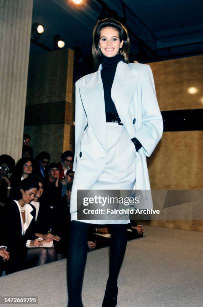 Model Elle MacPherson.Guest watch the show from the front row. Fall 1986 would be the last collection Perry Ellis designs with his studio.