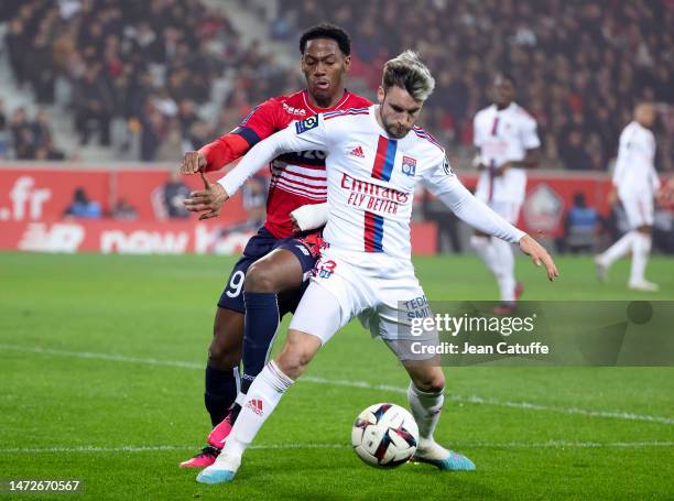 Jonathan David of Lille, Nicolas Tagliafico of Lyon during the Ligue 1 match between Lille OSC and Olympique Lyonnais at Stade Pierre-Mauroy on March...