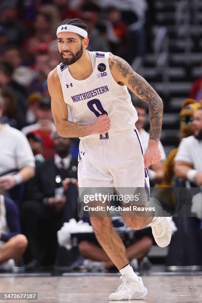 Boo Buie of the Northwestern Wildcats celebrates against the Penn State Nittany Lions during the first half in the quarterfinals of the Big Ten...