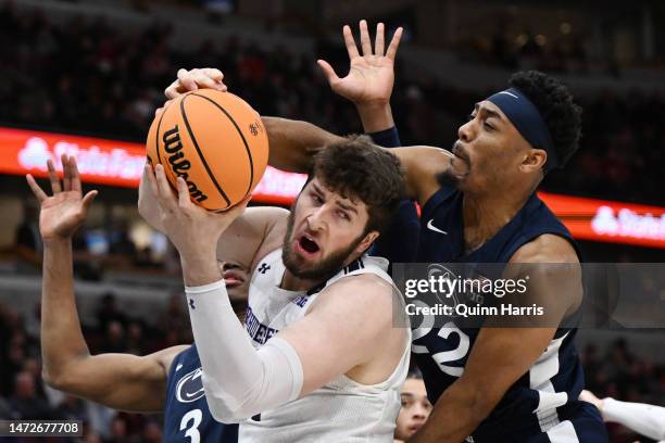 Matthew Nicholson of the Northwestern Wildcats battles Jalen Pickett of the Penn State Nittany Lions for the loose ball during the first half in the...