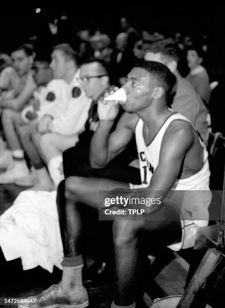 Oscar Robertson of the Cincinnati Bearcats drinks on the bench during the ECAC Holiday Festival basketball tournament at Madison Square Garden in New...