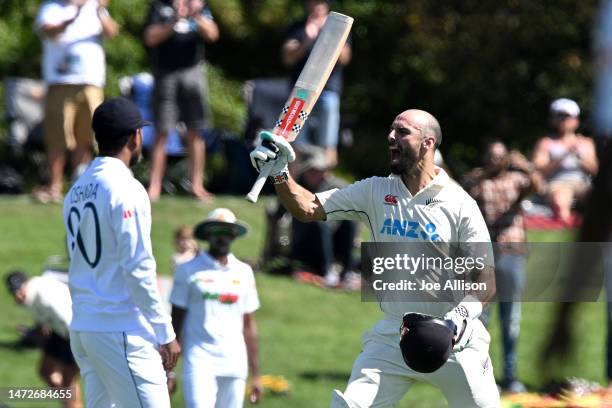 Daryl Mitchell of New Zealand celebrates after scoring a century during day three of the First Test match in the series between New Zealand and Sri...