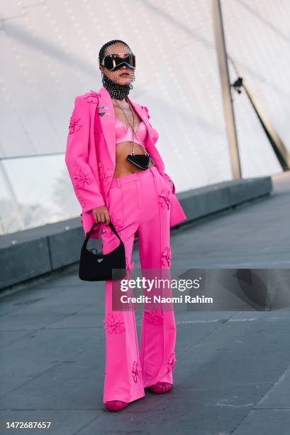 Charlene Davies is seen wearing a pink Prada suit, Balenciaga shoes, Prada bag and Culturesse accessories outside the Suit Up Runway at Melbourne...