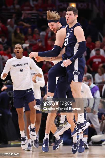 Michael Henn and Andrew Funk of the Penn State Nittany Lions celebrate after defeating the Northwestern Wildcats in overtime of the quarterfinals of...