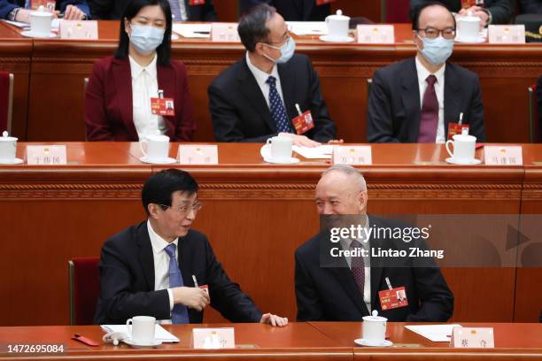 Delegates Wang Huning and Cai Qi attend the opening of the fourth plenary session of the National People's Congress on March 11, 2023 in Beijing,...