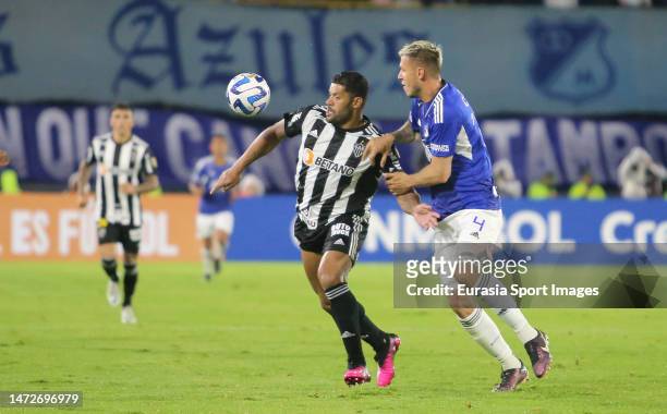 Juan Pablo Vargas of Millonarios fights for the ball with Hulk of Atletico Mineiro during Conmebol Libertadores 2023 match between Millonarios FC and...