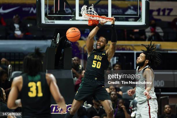 Nyzaiah Chambers of the Norfolk State Spartans dunks past Brendan Medley-Bacon of the North Carolina Central Eagles during the first half of the 2023...