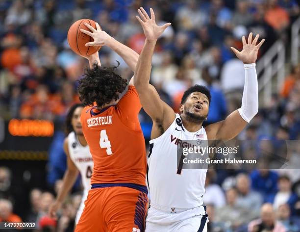 Jayden Gardner of the Virginia Cavaliers collides with Ian Schieffelin of the Clemson Tigers during the first half in the semifinals of the ACC...