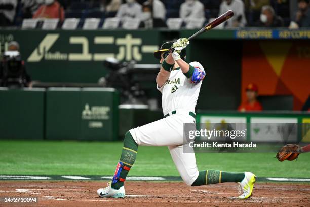 Aaron Whitefield of Team Australia RBI single to make it 0-5 in the third inning during the World Baseball Classic Pool B game between China and...