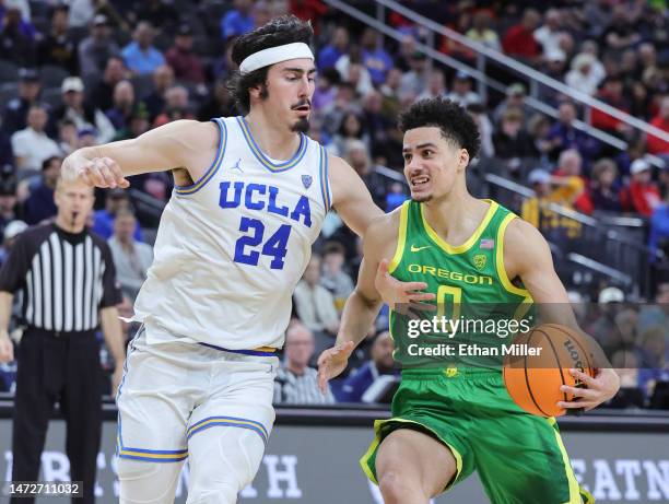 Will Richardson of the Oregon Ducks drives against Jaime Jaquez Jr. #24 of the UCLA Bruins in the second half of a semifinal game of the Pac-12...