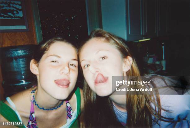 friends happy party, candid friends making funny faces sticking out tongue, 2000s fashion y2k style vintage photo - 2000 stock-fotos und bilder