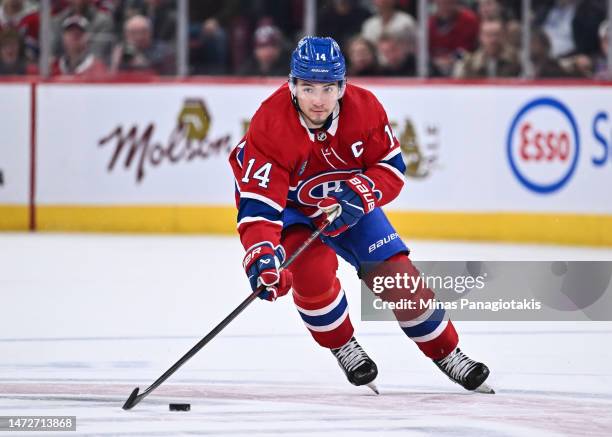 Nick Suzuki of the Montreal Canadiens skates the puck during the second period against the New York Rangers at Centre Bell on March 9, 2023 in...