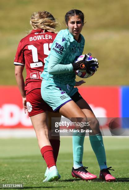 Morgan Aquino goalkeeper of Perth Glory save behind Katie Bowler of Adelaide United during the round 17 A-League Women's match between Adelaide...