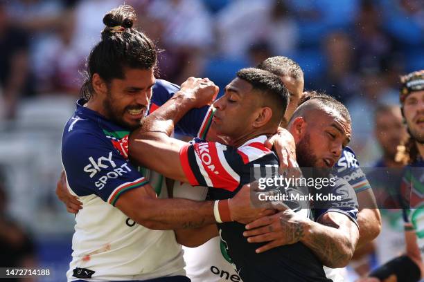 Daniel Tupou of the Roosters is tackled during the round two NRL match between the Sydney Roosters and the New Zealand Warriors at Allianz Stadium on...