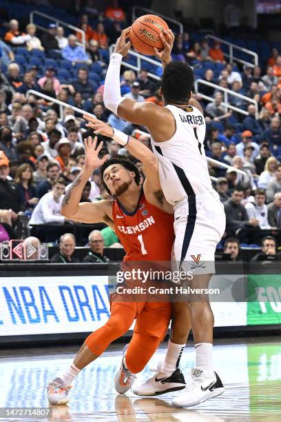 Chase Hunter of the Clemson Tigers attempts to defend Jayden Gardner of the Virginia Cavaliers during the second half in the semifinals of the ACC...