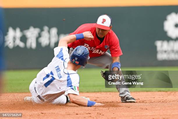 Sal Frelick of Team Italy get tag out by Rubén Tejada of Team Panama at the bottom of the first inning during the World Baseball Classic Pool A game...