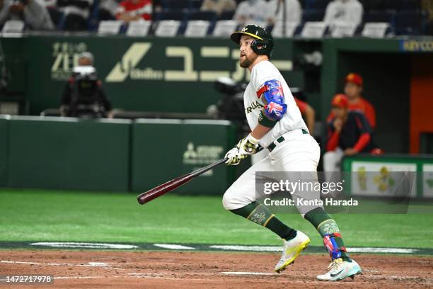 Aaron Whitefield of Team Australia hits an RBI double to make it 2-8 in the fourth inning during the World Baseball Classic Pool B game between China...