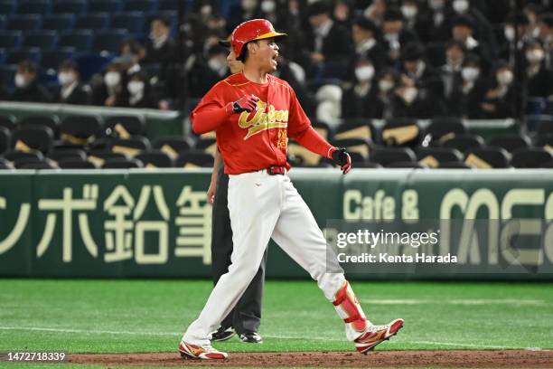 Jinjun Luo of Team China RBI celebrates a single to make it 5-2 in the forth inning during the World Baseball Classic Pool B game between China and...