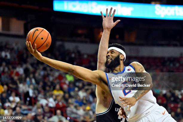 Naje Smith of the Boise State Broncos drives to the basket against the Utah State Aggies during the first half of a semifinal game of the Mountain...