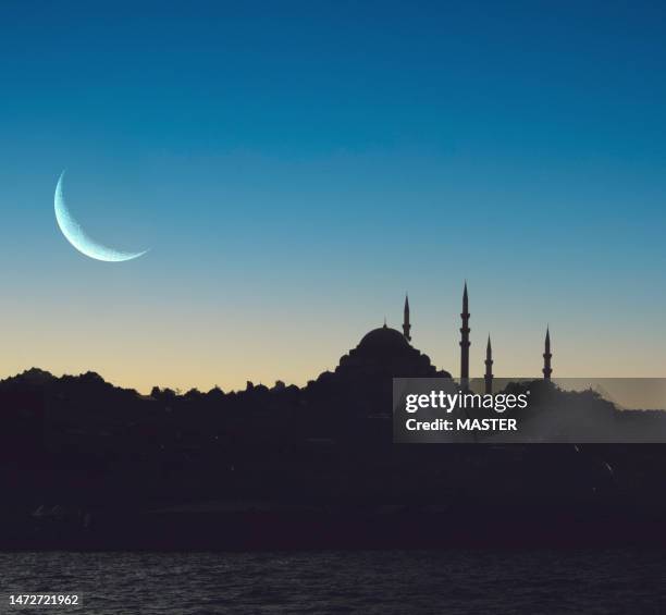 ramadan moon is coming over mosque sky - crescent stock pictures, royalty-free photos & images