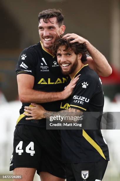 Daniel De Silva of the Bulls celebrates with Matthew Millar of the Bulls after scoring a goal during the round 20 A-League Men's match between...