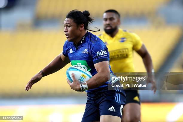 Caleb Clarke of the Blues runs in for a try during the round three Super Rugby Pacific match between Hurricanes and Blues at Sky Stadium, on March 11...