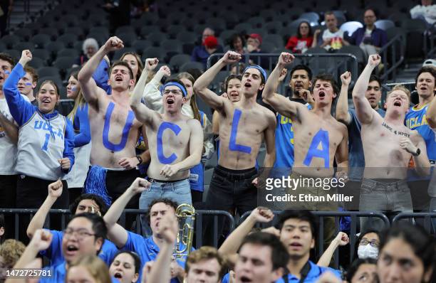 Bruins fans cheer before the team's semifinal game of the Pac-12 basketball tournament against the Oregon Ducks at T-Mobile Arena on March 10, 2023...