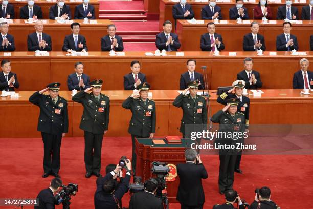 Vice chairman of the Central Military Commission of the People's Republic of China Zhang Youxia and He Weidong , swears an oath with members of the...