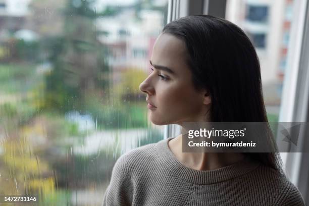 sad woman feeling negative emotions - winter blues 個照片及圖片檔