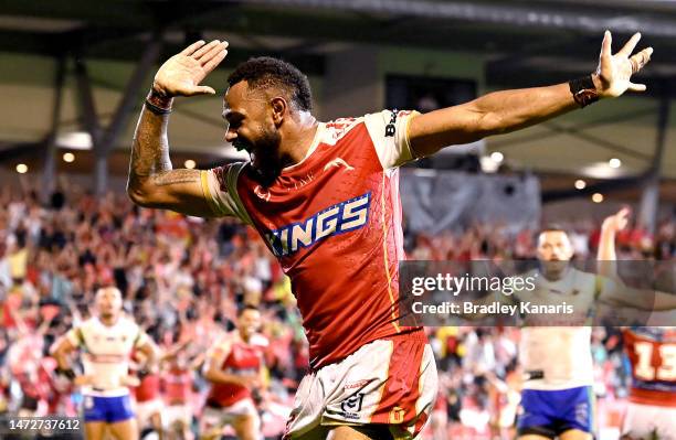 Hamiso Tabuai-Fidow of the Dolphins celebrates scoring a try during the round two NRL match between the Dolphins and the Canberra Raiders at Kayo...