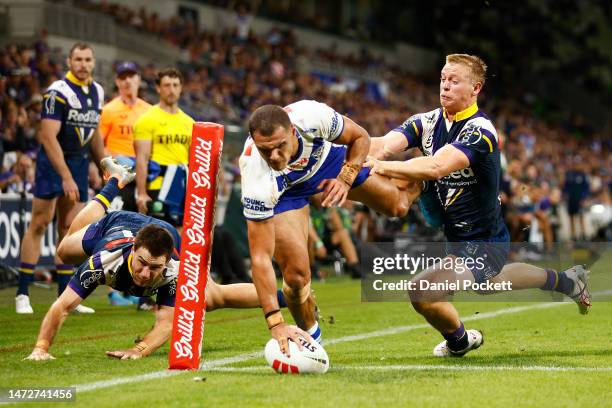 Jacob Kiraz of the Bulldogs scores a try during the round two NRL match between the Melbourne Storm and Canterbury Bulldogs at AAMI Park on March 11,...