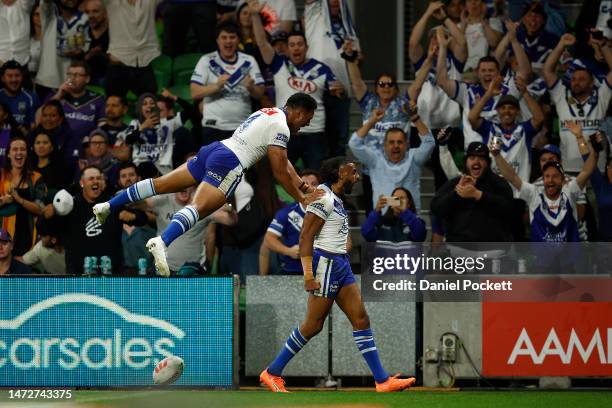 Josh Addo-Carr of the Bulldogs celebrates with Paul Alamoti of the Bulldogs after scoring a try during the round two NRL match between the Melbourne...