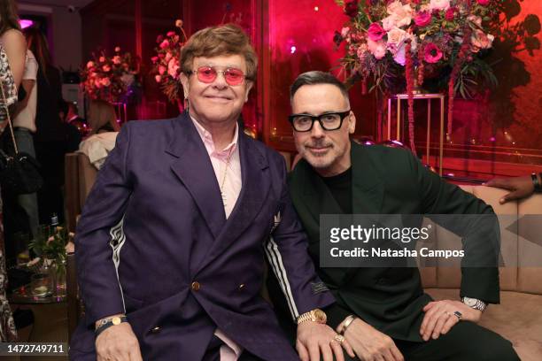 Elton John and David Furnish attend the The CAA Pre-Oscar Party at Sunset Tower Hotel on March 10, 2023 in Los Angeles, California.