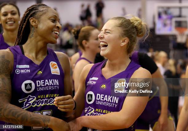 Tiffany Mitchell of the Boomers and Taylor Ortlepp of the Boomers celebrate the win during game two of the WNBL Semi Final series between Melbourne...