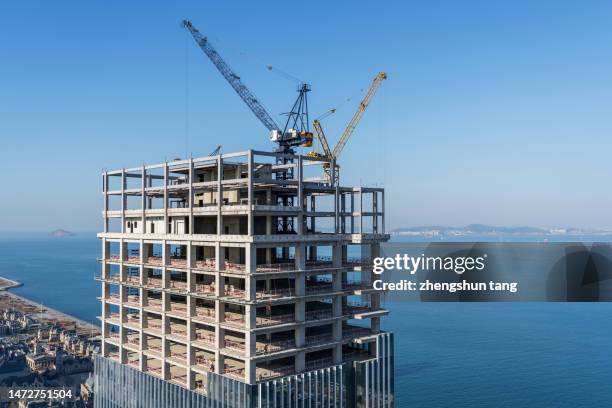 aerial view of working construction site - condo building construction stock pictures, royalty-free photos & images