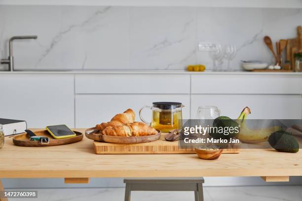 fresh croissants on the kitchen table - close up counter stock pictures, royalty-free photos & images